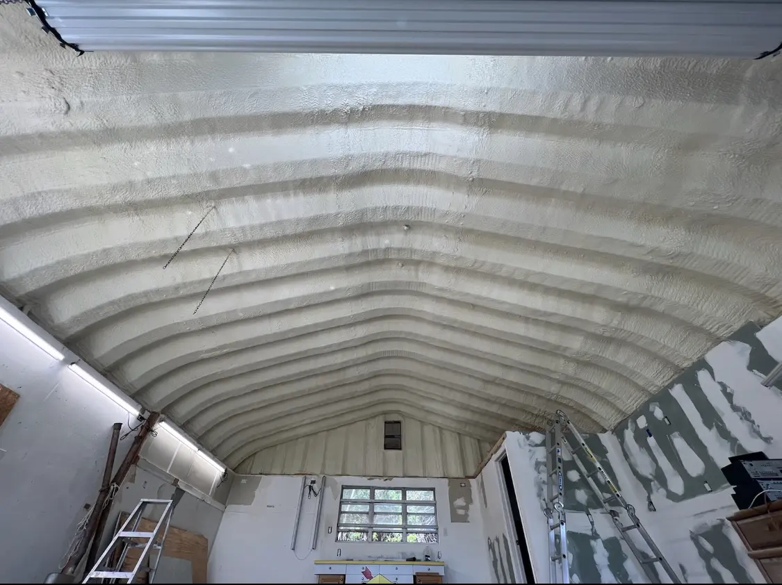 Spray polyurethane foam applied to the underside of a metal roof deck in Delran